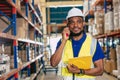 warehouse african black male worker. inventory clerk staff working radio control loading check remaining products in stock