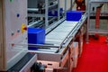 Warehouse automation. Automated conveyor lines with robotic manipulator Royalty Free Stock Photo