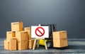 Warehouse with boxes and forklift and easel with prohibition sign NO. Out of stock. Restrictions ban on import goods. Sanctions