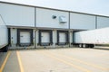 Warehouse building with 53 foot dry van trailers backed into doc Royalty Free Stock Photo