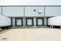 Warehouse building with 53 foot dry van trailers backed into doc Royalty Free Stock Photo