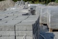 Warehouse of building materials. Lots of Pallets of gray paving