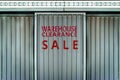 Warehouse clearance sale sign in metal wall