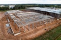 Warehouse Construction from metal structure. Industrial building on light gauge steel framing. Frame of modern hangar or factory.