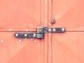 Warehouse door with security locked latch lock and safety lock insert