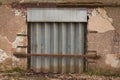 Abandoned old Warehouse with steel shutter doorway