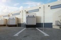 Warehouse exterior with shutter doors and truck parking lots Royalty Free Stock Photo