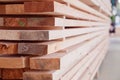 Warehouse or factory for sawing boards on sawmill indoors. Wood timber stack of wooden blanks construction material