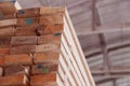 Warehouse or factory for sawing boards on sawmill indoors. Wood timber stack of wooden blanks construction material