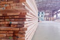 Warehouse or factory for sawing boards on sawmill indoors. Wood timber stack of wooden blanks construction material