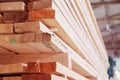 Warehouse or factory for sawing boards on sawmill indoors. Wood timber stack of wooden blanks construction material