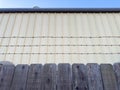 a warehouse fence barbed wire fencing commercial building industry industrial facility storage alleyway alley safety concept Royalty Free Stock Photo