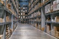 The warehouse full of goods, boxes and shelves in order