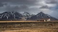 Warehouse in of Iceland with snowy mountains in spring Royalty Free Stock Photo