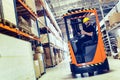 Warehouse worker doing logistics work with forklift loader Royalty Free Stock Photo