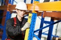 Warehouse installer worker examining quality