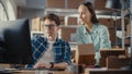 Warehouse Inventory Manager and Worker Using Desktop Computer, Preparing a Parcel for Shipping Royalty Free Stock Photo