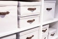 Warehouse loaded with boxes.stack of white textile office boxes. selective focus.Stacks of paperwork placed in