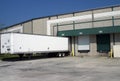 Warehouse loading bays with trailer Royalty Free Stock Photo