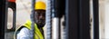 Warehouse man worker driver forklift. warehouse worker driver stacking card boxes by forklift in warehouse store. African American Royalty Free Stock Photo