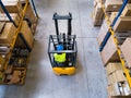 Warehouse man worker with forklift. Royalty Free Stock Photo