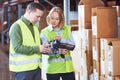 Warehouse Management System. Worker with barcode scanner Royalty Free Stock Photo