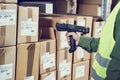 Warehouse Management System. Worker with barcode scanner Royalty Free Stock Photo