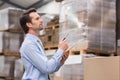 Warehouse manager checking his inventory Royalty Free Stock Photo