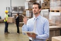 Warehouse manager checking his inventory Royalty Free Stock Photo