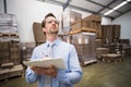 Warehouse manager checking his inventory Royalty Free Stock Photo