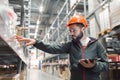 Warehouse manager checking his inventory in a large warehouse Royalty Free Stock Photo