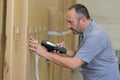 warehouse manager scanning barcode on boxes