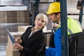 Warehouse manager talking with forklift driver Royalty Free Stock Photo