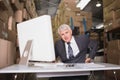Warehouse manager using computer Royalty Free Stock Photo