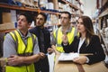Warehouse manager and workers talking