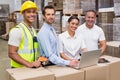 Warehouse managers and worker looking at camera Royalty Free Stock Photo