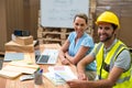 Warehouse managers and workers smiling in warehouse Royalty Free Stock Photo