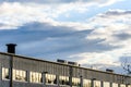 Warehouse office windows over cloudy sunset sky in england uk Royalty Free Stock Photo