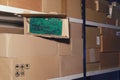 Warehouse with opened boxes with computer equipment. Theft of electronics parts in a mail warehouse during quarantine due to