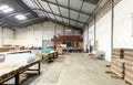 warehouse, plant and factory area and interior with machinery, inventories, shelves, pallets and boxes