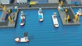 Warehouse port Isometric projection. Ships with containers on the berth at the port, cranes, workers. cars, hangars