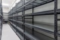 Warehouse racks storage metal pallet racking system in warehouse. Modern interior of new empty warehouse. The shelves are pallet