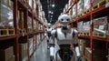 Warehouse Robots. A sleek robot navigating an organized warehouse filled with shelves of boxes. Royalty Free Stock Photo