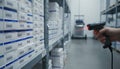 Warehouse shelf with barcode scan highlighting supply chain precision logistic workflow retail inventory control in Royalty Free Stock Photo