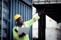 Warehouse shipping transportation concept. Commercial docks worker and inspector at commercial dock. Workers are wearing Royalty Free Stock Photo