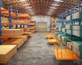 Warehouse space with a lot of racks with plywood, drywall and osb sheets, a few empty trolleys for long loads are standing near