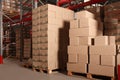 Warehouse with stacks of boxes on wooden pallets. Wholesaling