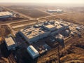 Warehouse storage or industrial factory or logistics center from above. Industrial buildings and equipment machines, aerial view