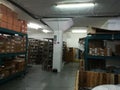 Warehouse or store room, with items in racking