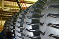 Warehouse with tires for trucks at an industrial plant for the production of cars. The protector of a large rubber wheel. Rubber Royalty Free Stock Photo